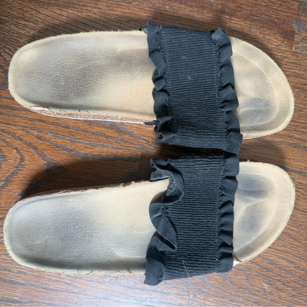 Well worn but still functional Black Ruffle Slide Sandals